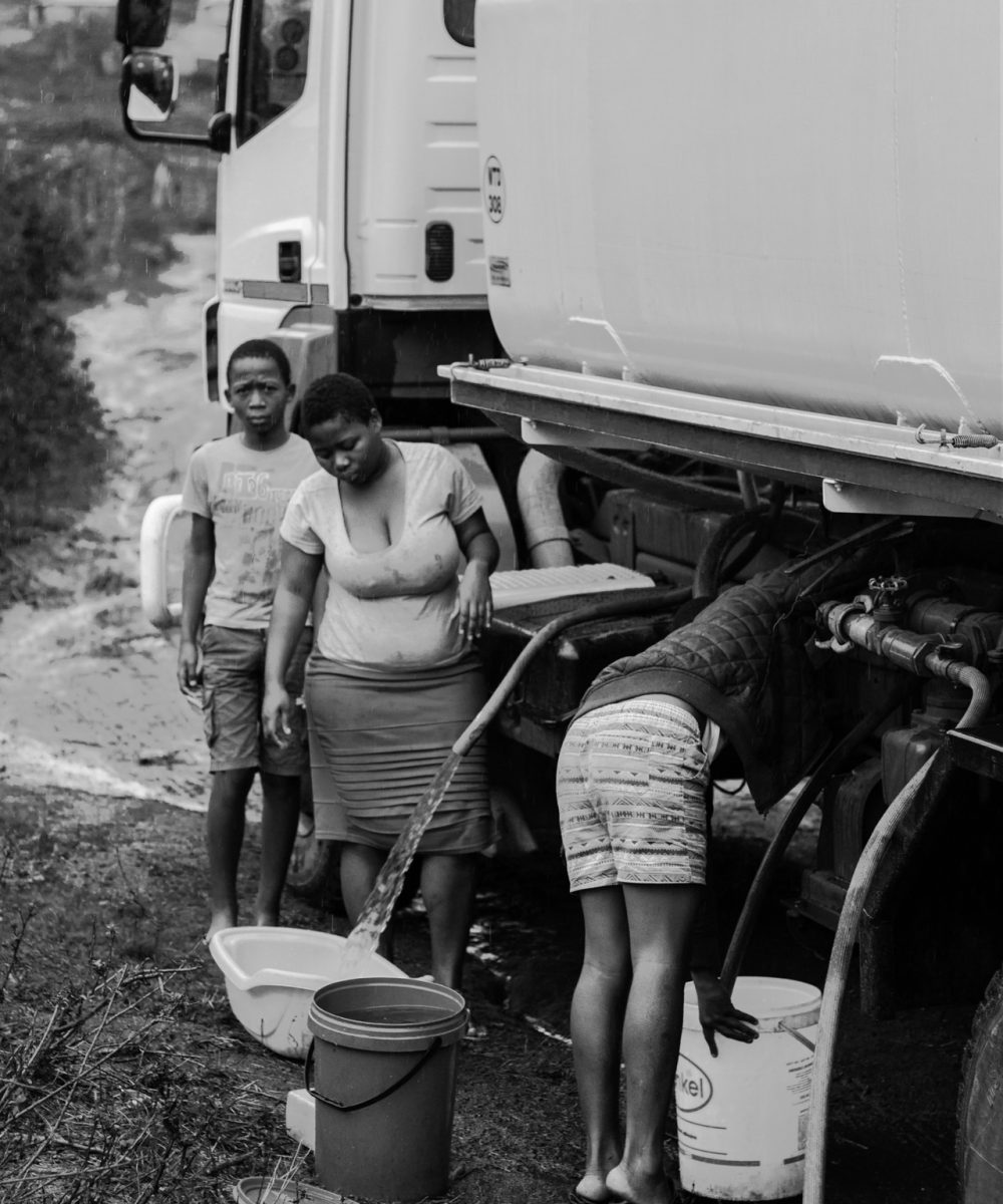3_Baby Basin 1_, 2018, Eskebheni, Inanda, Durban (KZN). A young girl is collecting water from a tanker using a baby basin as a storage container.